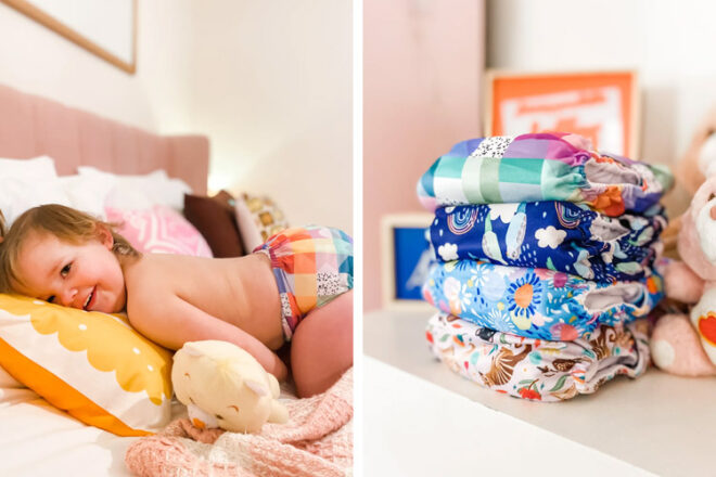Petite fille sur le lit portant une paire de couches lavables modernes Cloth & Crown aux côtés d'une pile de couches de différents modèles