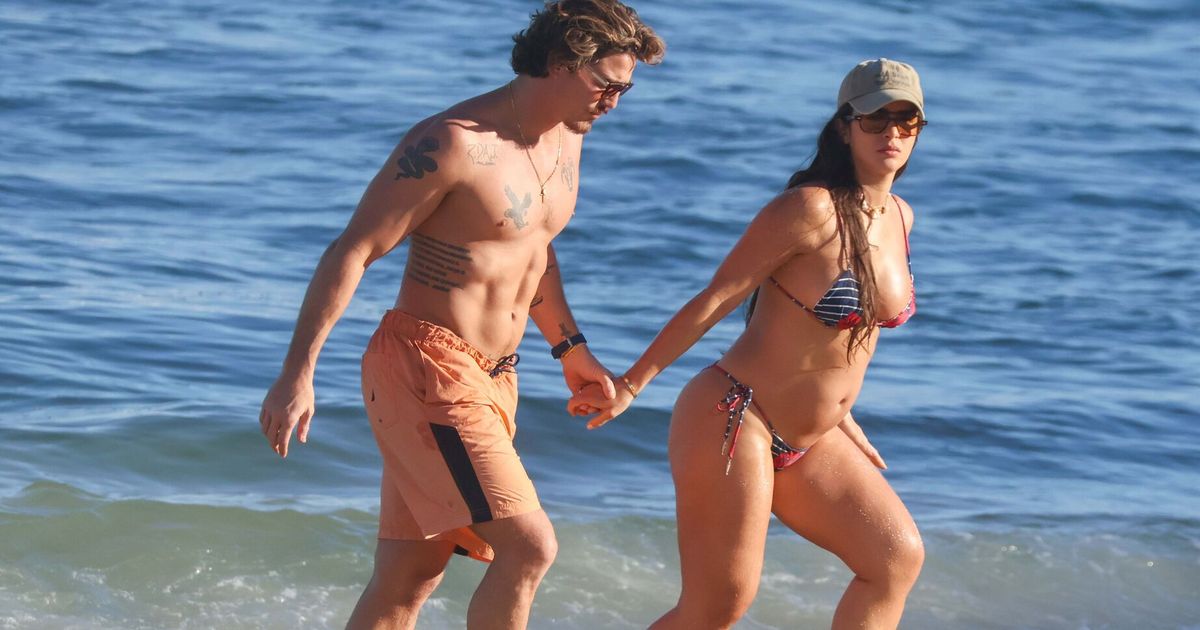 Mari Saad exhibe son ventre de femme enceinte sur la plage et échange des baisers passionnés avec Rômulo Arantes Neto. Découvrez les photos du couple !